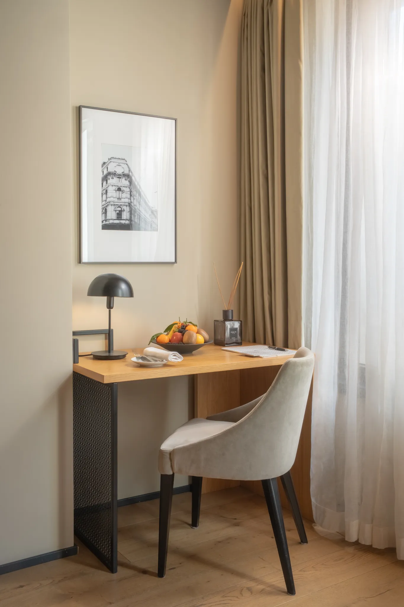 Writing desk — brass, walnut, afternoon light on paper